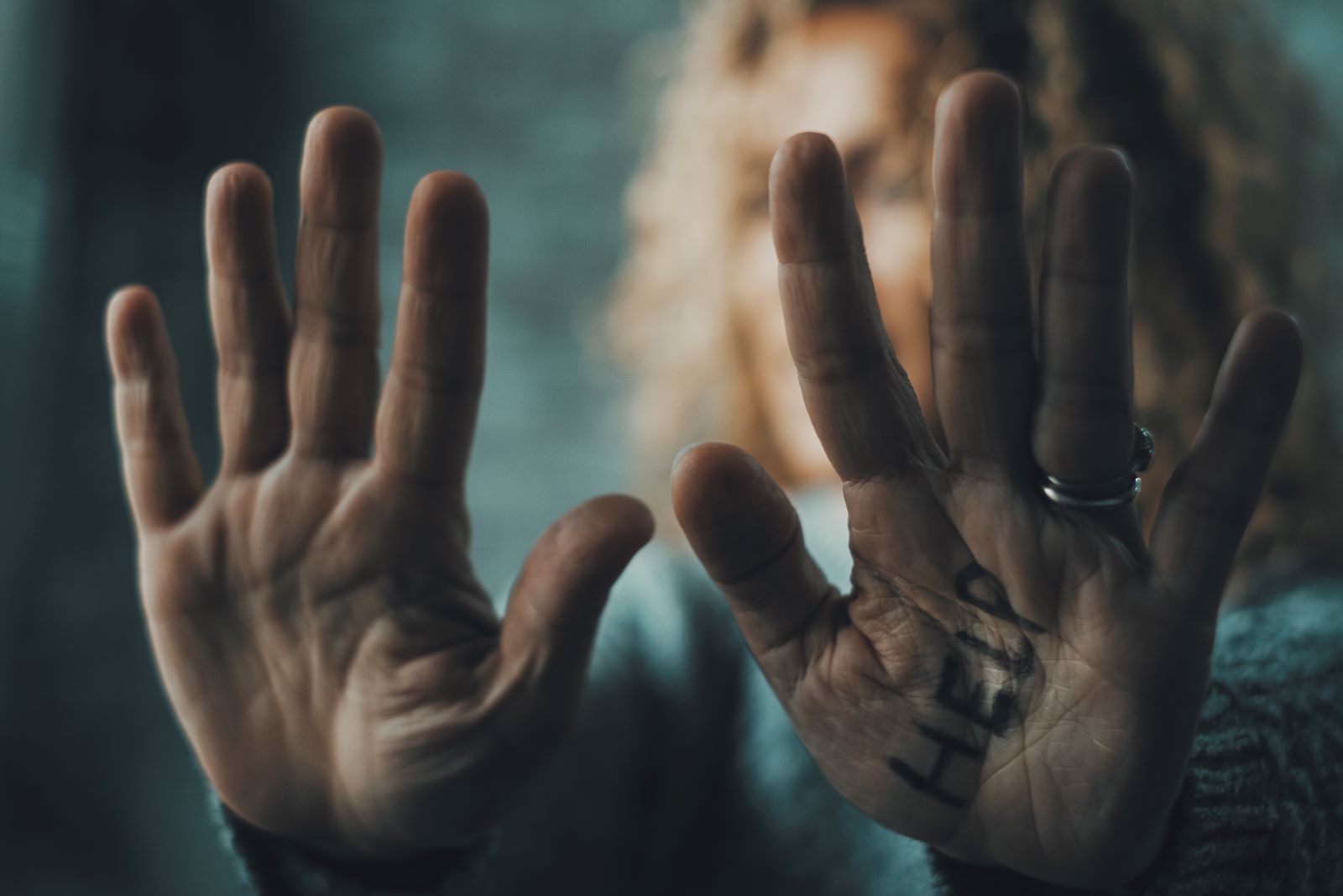 close up of woman hands with help domestic violence